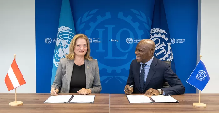 Ratification ceremony of Convention No. 190 on 11 September 2024: Ambassador Désirée Schweitzer, Permanent Representative of Austria to the United Nations in Geneva, and Gilbert F. Houngbo, Director-General of the ILO.