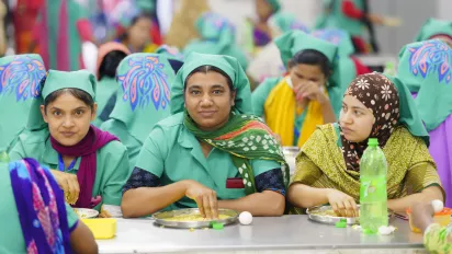 3 women at lunch break in factory