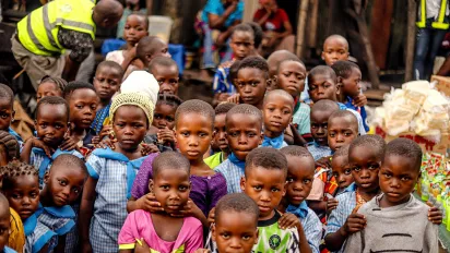 A group photo of a large group of children in Africa.