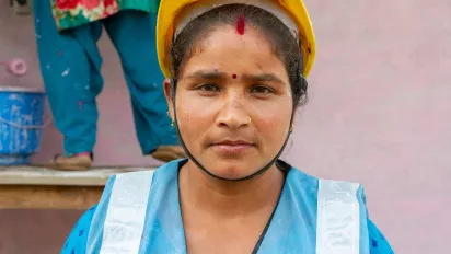 Woman wearing a worksite safety helmet