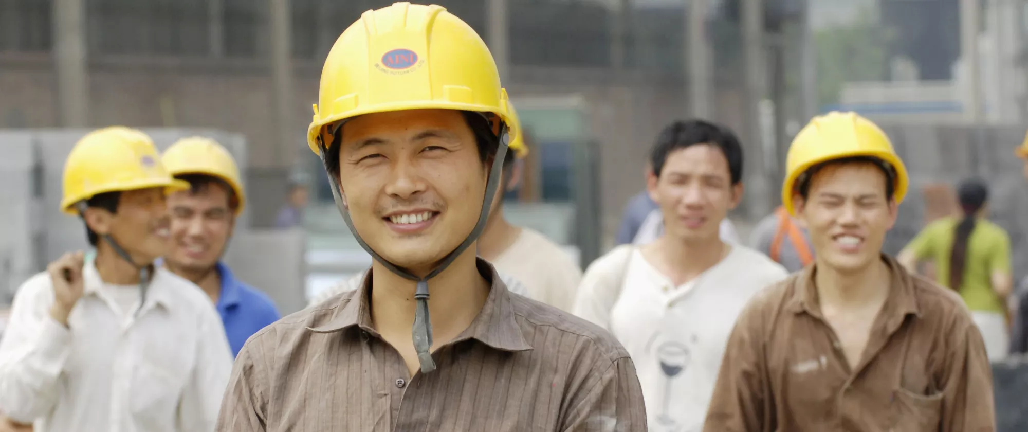 Migrant workers smiling