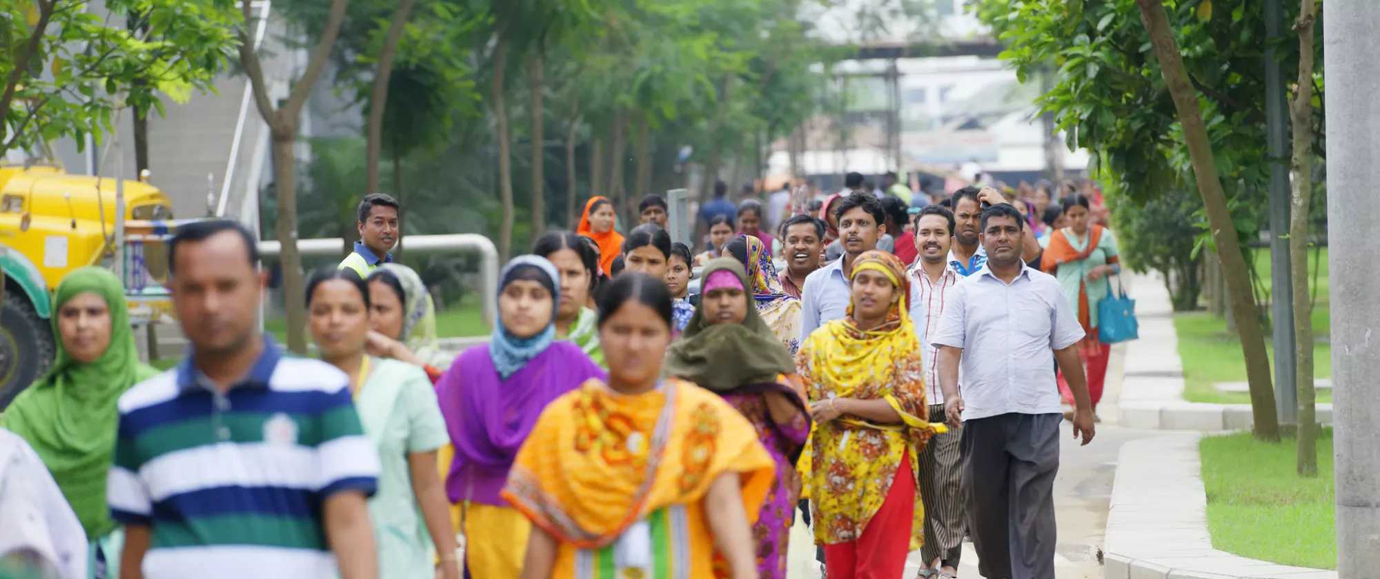 Garment employees are seen leaving a clothing plant at the end of their working day in Bangladesh