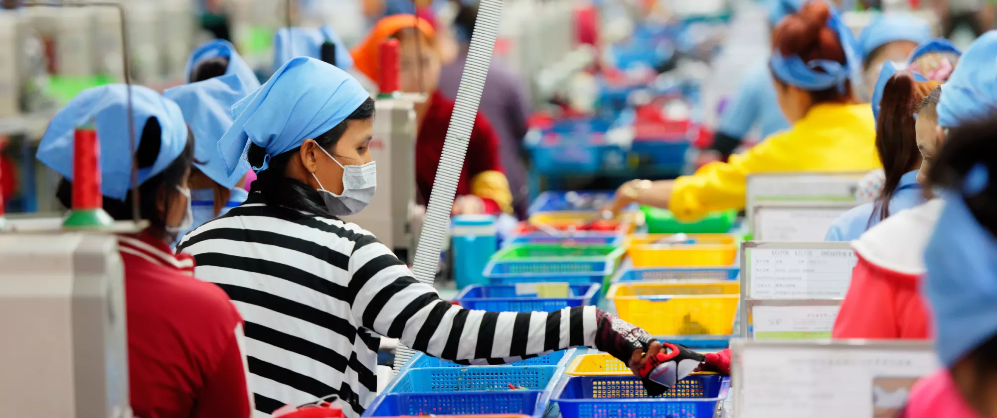 Cambodian workers are seen in a local footwear manufacturing plant.