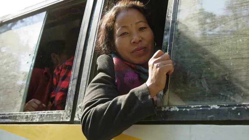 Woman looking out of bus window